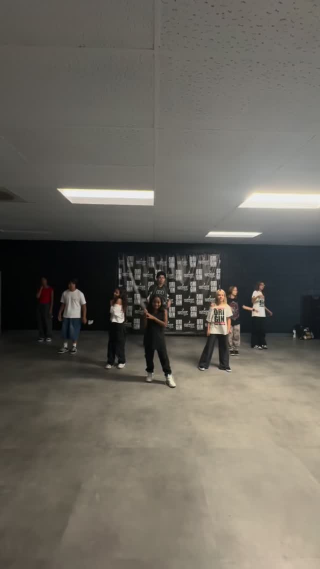 Group of dancers practicing popping with Gio at The Origin